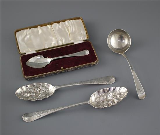 Two 18th century silver berry spoons a George III silver sauce ladle, London, 1773 and a cased silver small server, Sheffield, 190